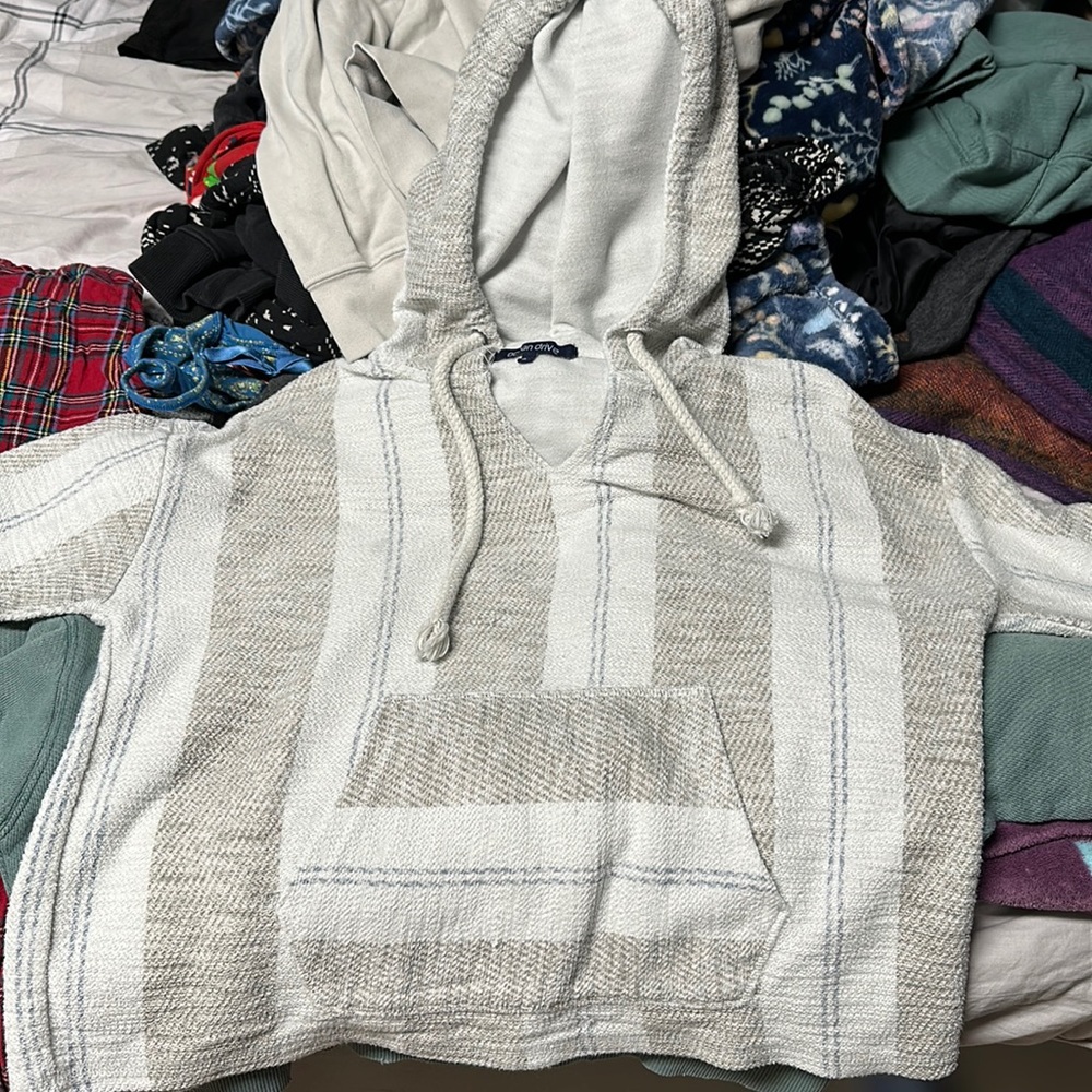 white, gray, and blue crop sweatshirts